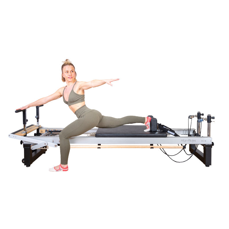 Align-Pilates A8-Pro Pilates Reformer with woman do an exercise with reformer