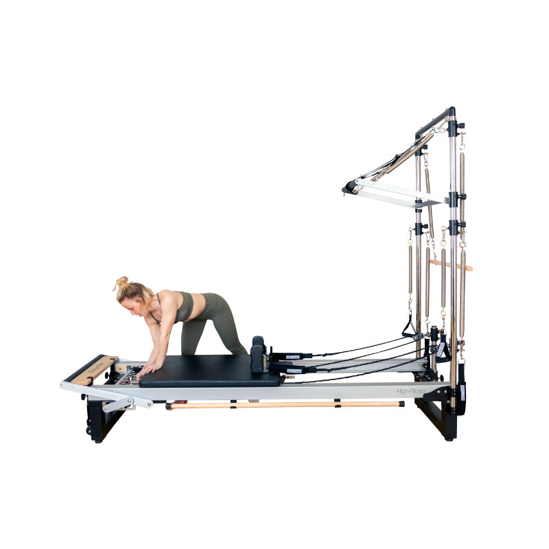 Align-Pilates A8-Pro Pilates Reformer woman adjusting springs