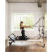 Align-Pilates C8-S Pro Pilates Reformer with girl exercising