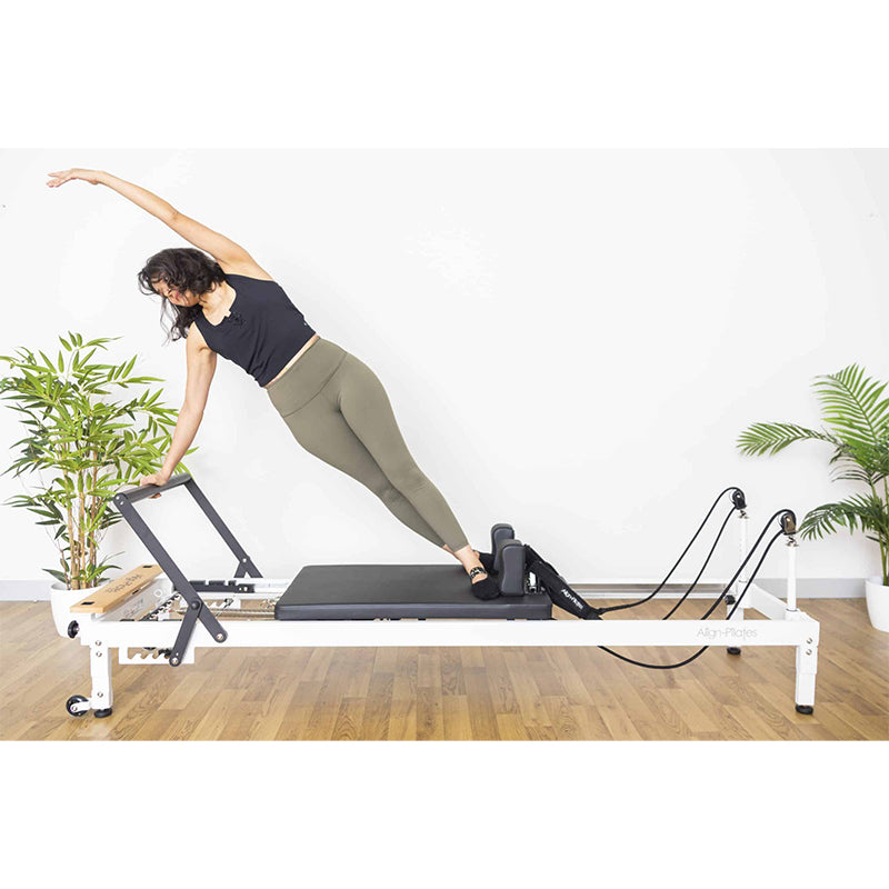 Align-Pilates R8-Pro Pilates Reformer White girl exercising