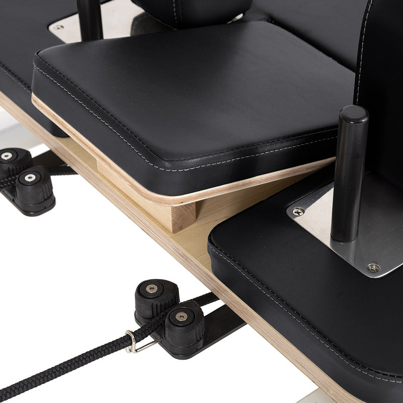 Elina Pilates Lignum Reformer in black adjustable headrest