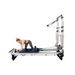 a8 pro pilates reformer woman adjusting springs