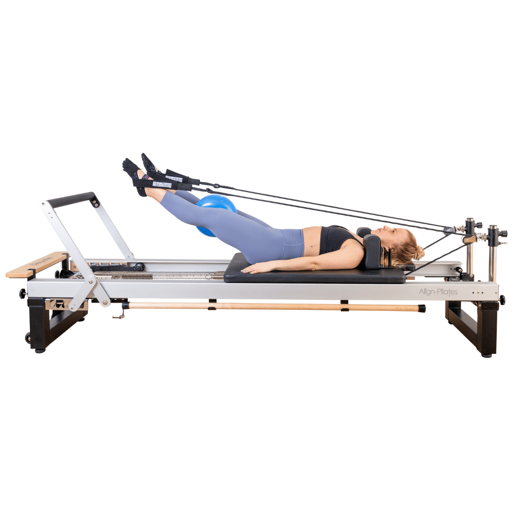alighn pilates a8 pro reformer with girl exercising