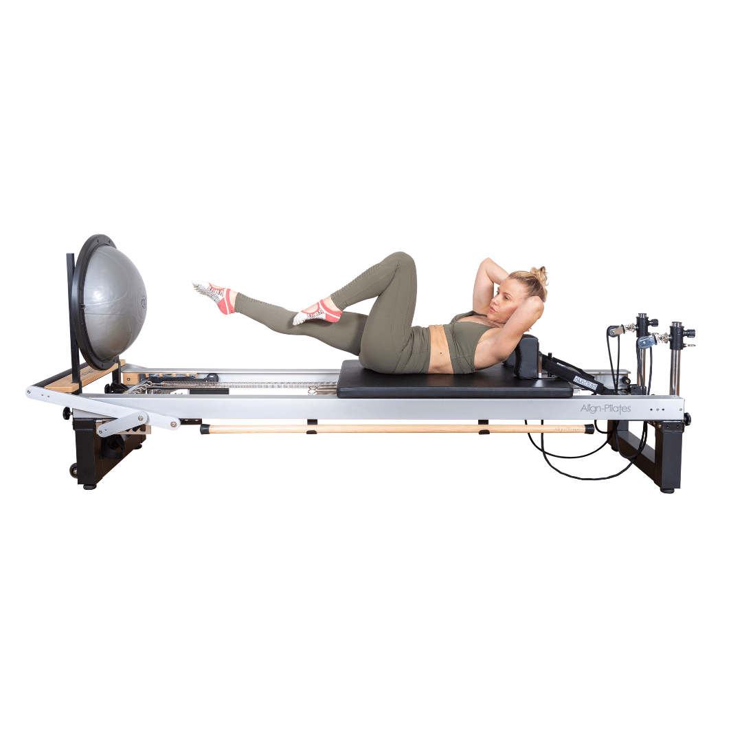 align pilates a8 pro pilates reformer with woman exercising