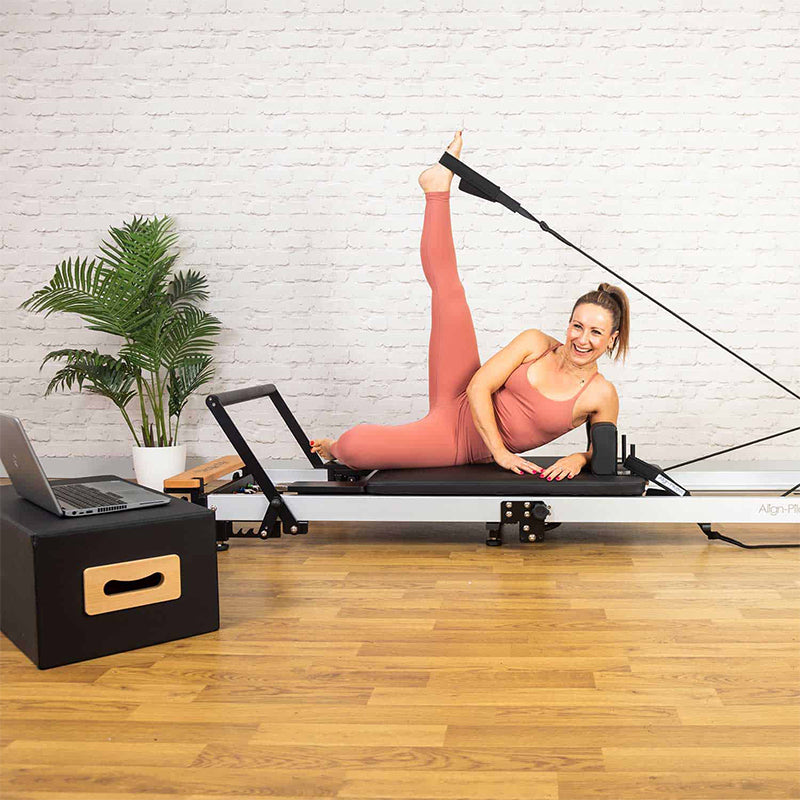 align pilates reformer fold us woman exercising