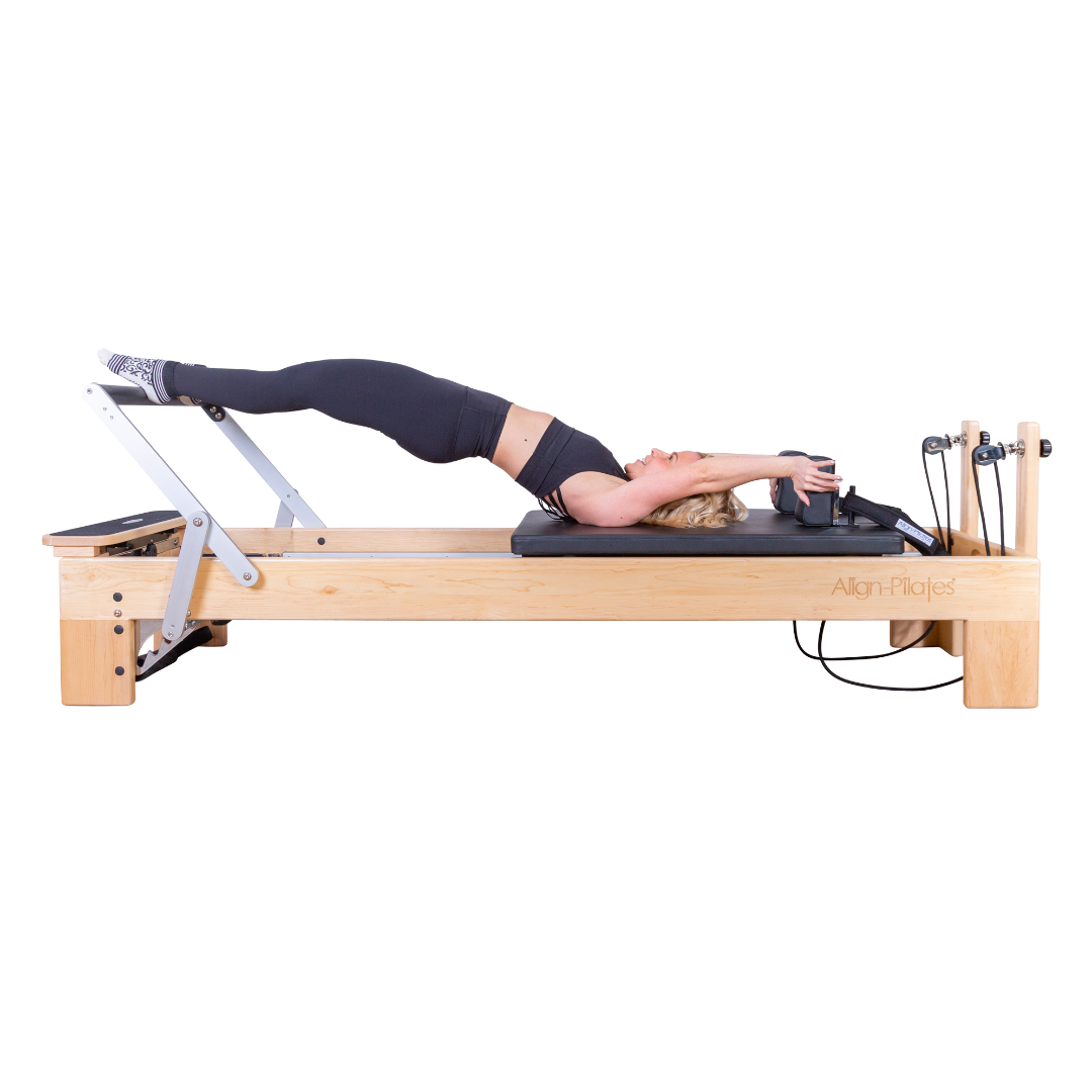m8 pro reformer with lady working out